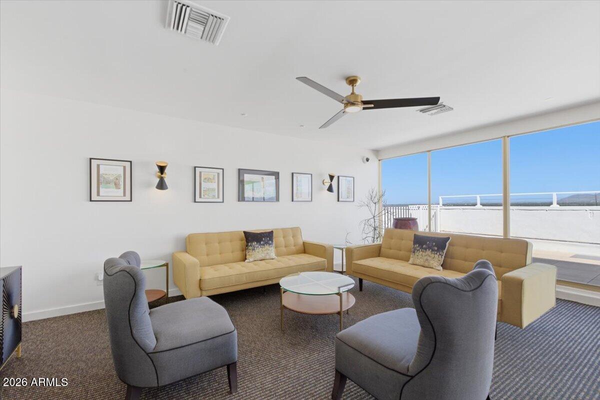 4750 North Central Avenue, Unit B14 Phoenix, AZ 85012 - Photo 31 of 57 a living room with furniture and a window