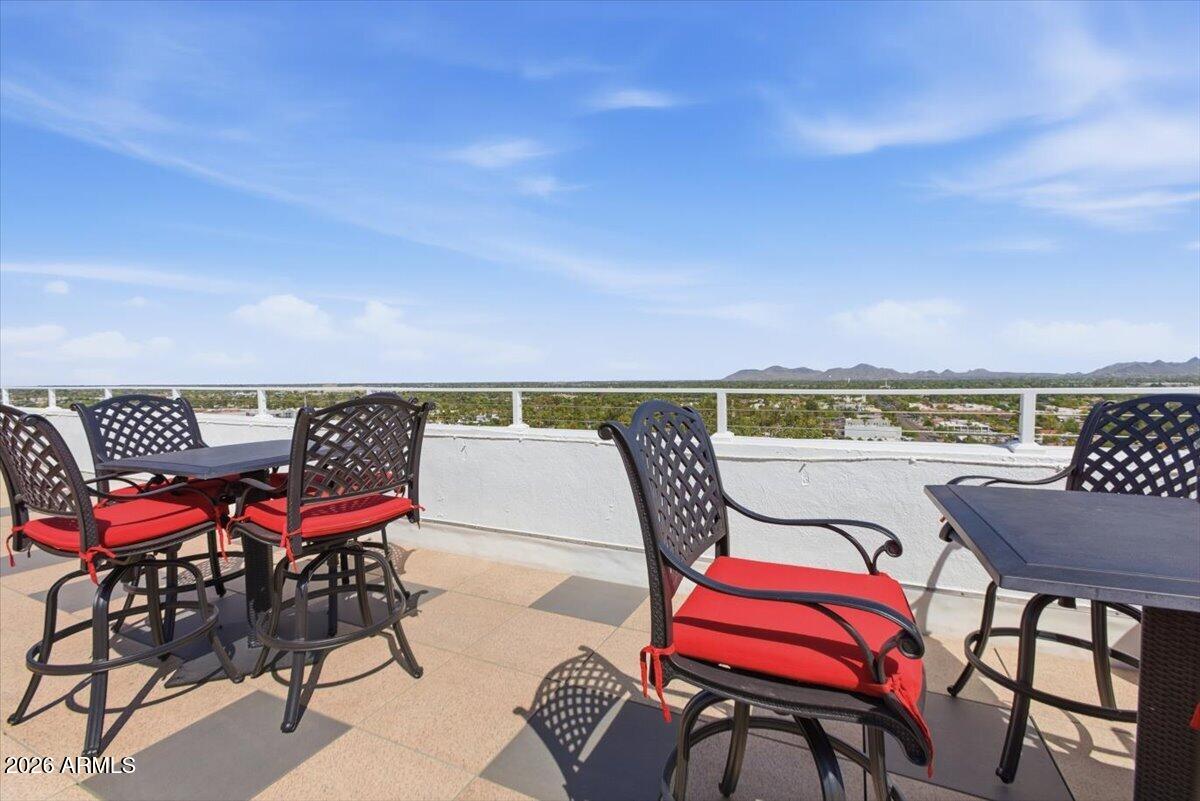 4750 North Central Avenue, Unit B14 Phoenix, AZ 85012 - Photo 39 of 57 a terrace with outdoor seating and city view