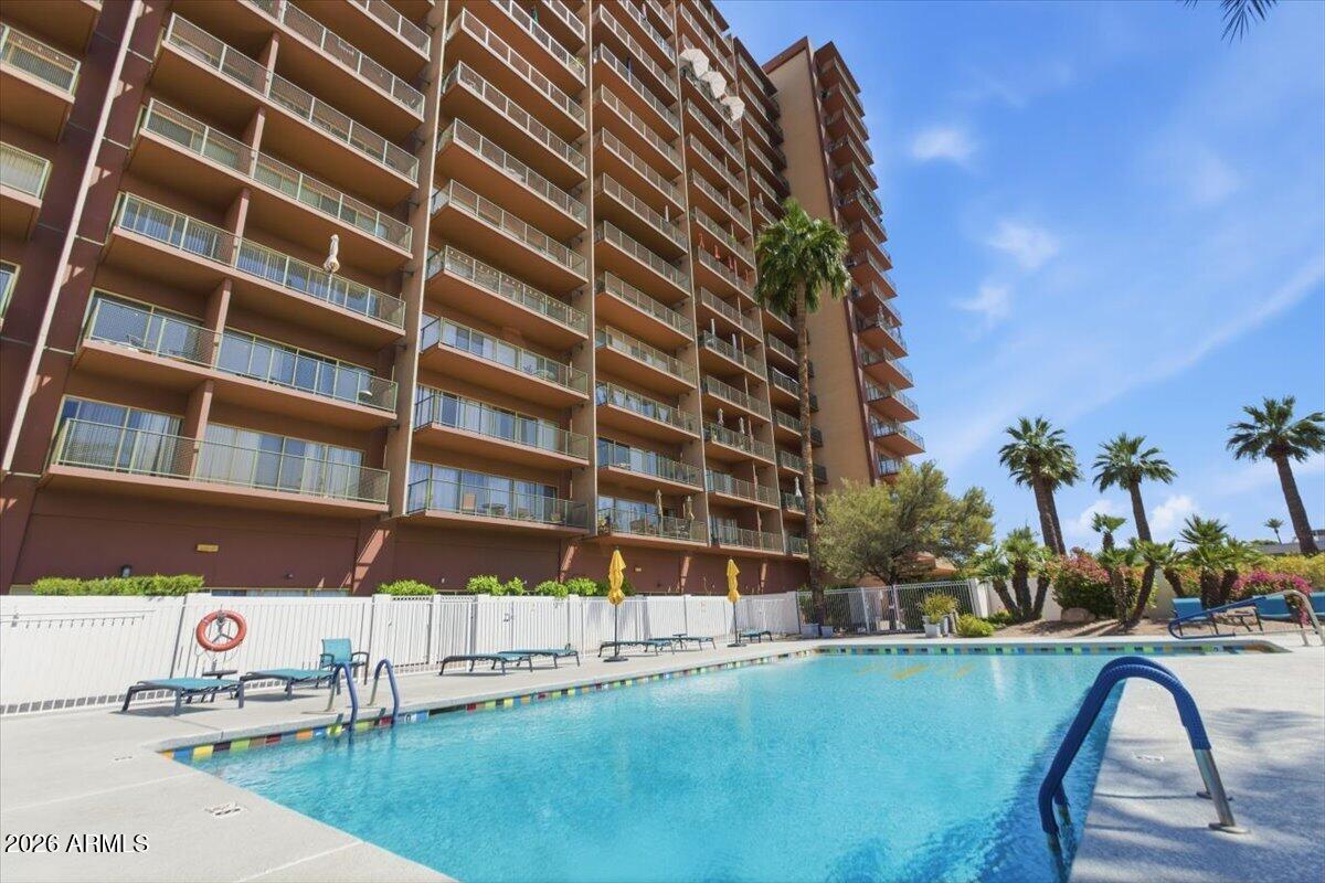 4750 North Central Avenue, Unit B14 Phoenix, AZ 85012 - Photo 47 of 57 a view of a swimming pool with a lounge chairs