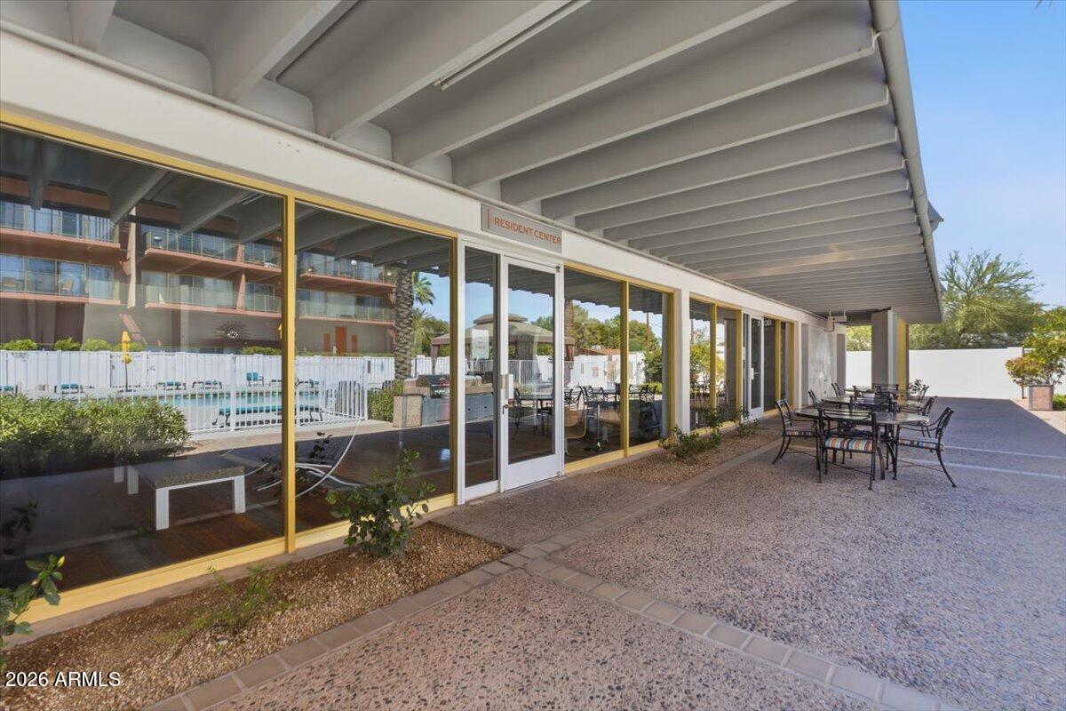 4750 North Central Avenue, Unit B14 Phoenix, AZ 85012 - Photo 54 of 57 a view of a porch with chairs and table in a patio