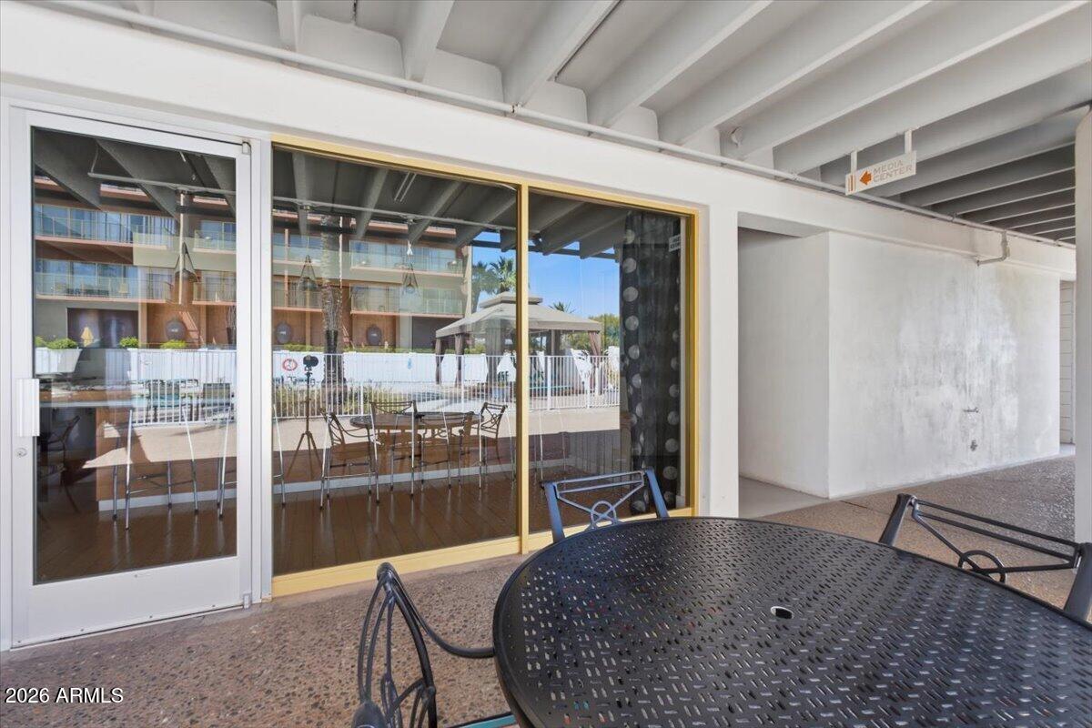 4750 North Central Avenue, Unit B14 Phoenix, AZ 85012 - Photo 55 of 57 a view of a hallway with a view of living room