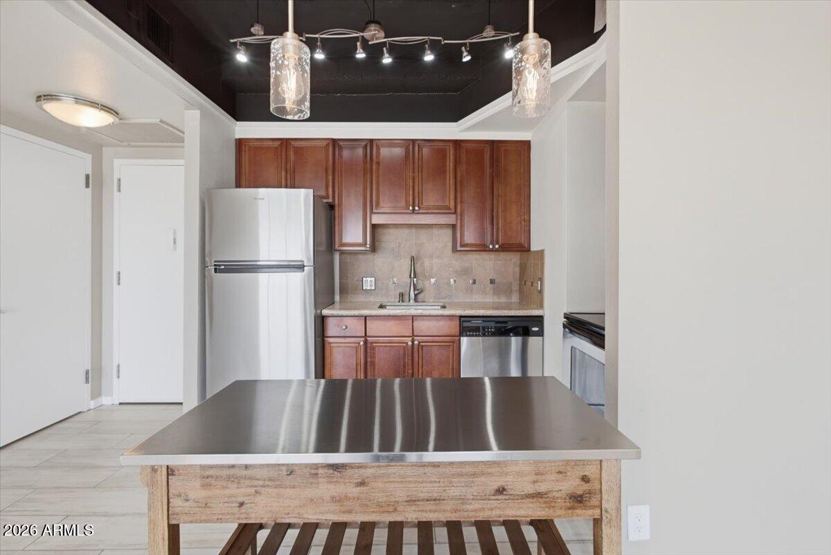 4750 North Central Avenue, Unit B14 Phoenix, AZ 85012 - Photo 9 of 57 view of kitchen with refrigerator microwave and cabinets