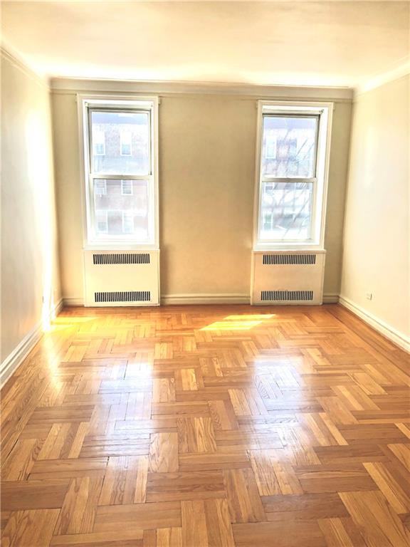 1900 Quentin Road, Unit E5 Brooklyn, NY 11229 - Photo 15 of 17 a view of an empty room with a window