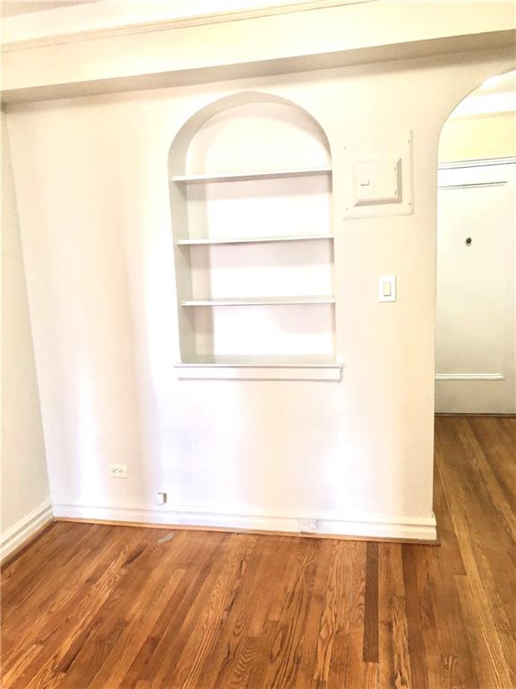 1900 Quentin Road, Unit E5 Brooklyn, NY 11229 - Photo 9 of 17 a view of a room with wooden floor and a window