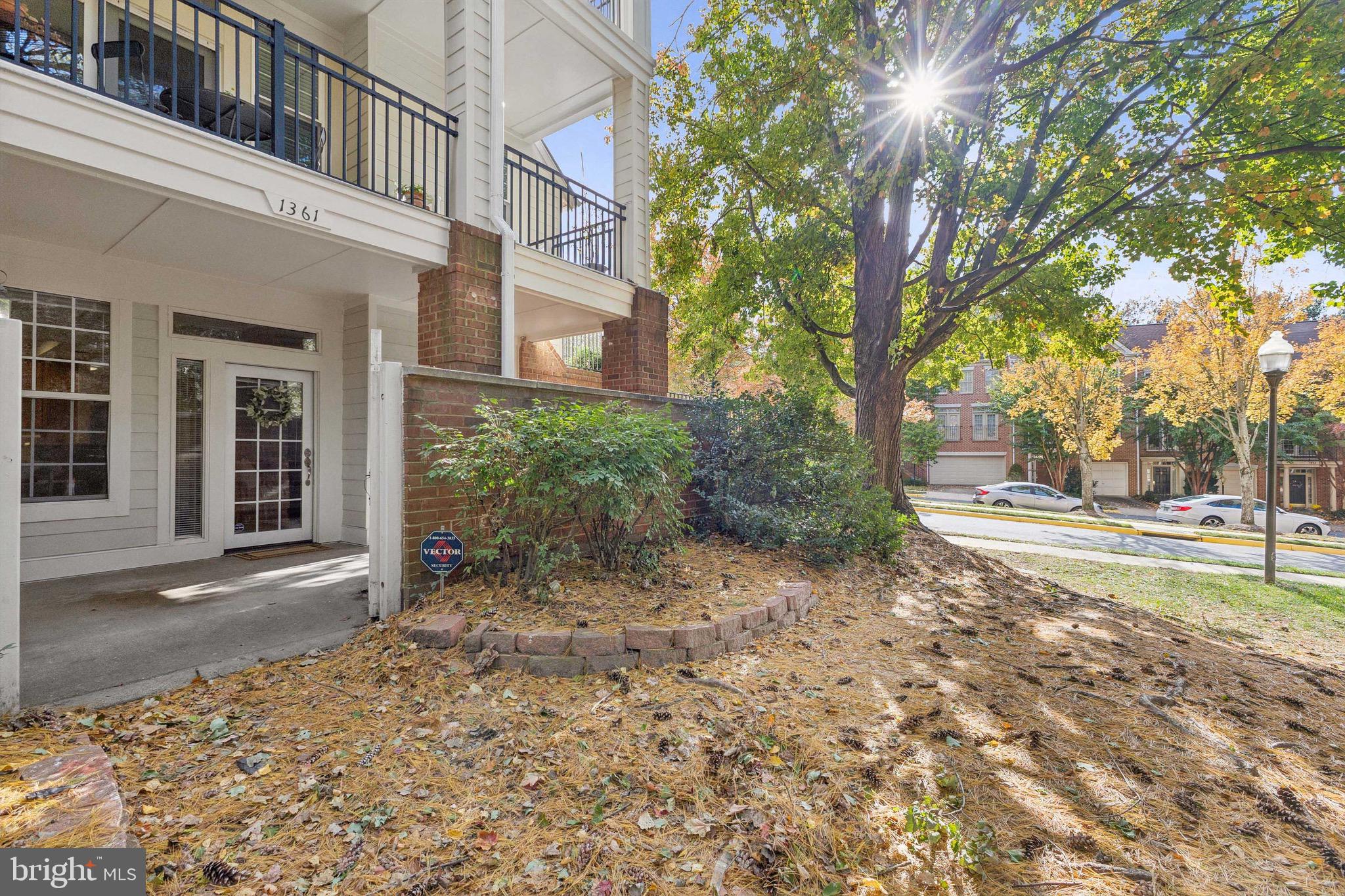 1361 Garden Wall Circle, Unit 701 Reston, VA 20194 - Photo 1 of 15 a view of a yard with plants and trees