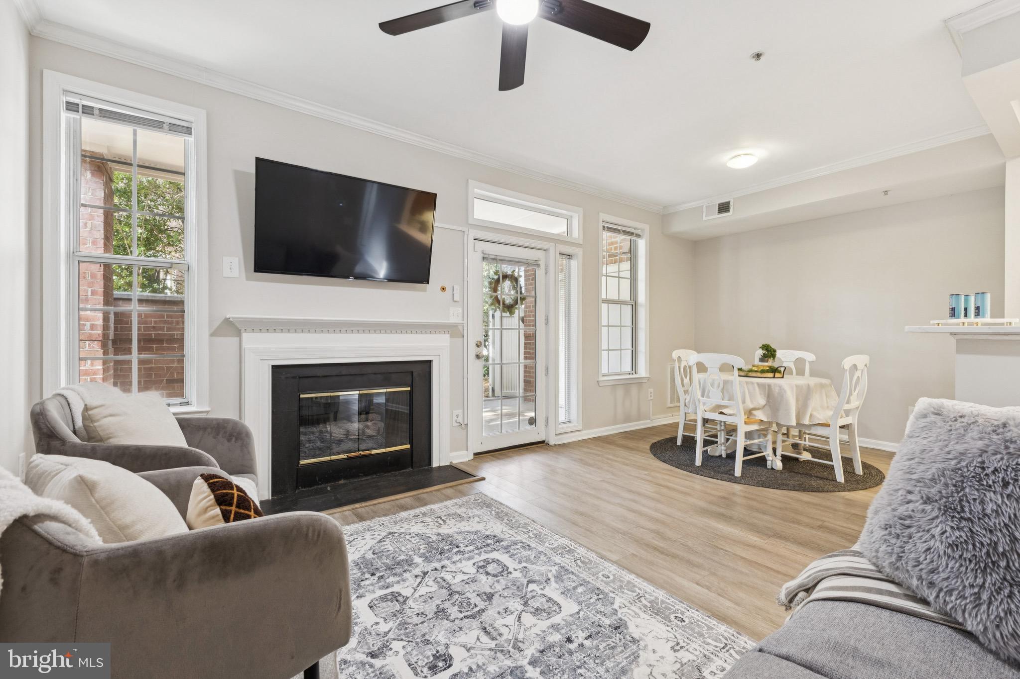 1361 Garden Wall Circle, Unit 701 Reston, VA 20194 - Photo 3 of 15 a living room with furniture fireplace and window