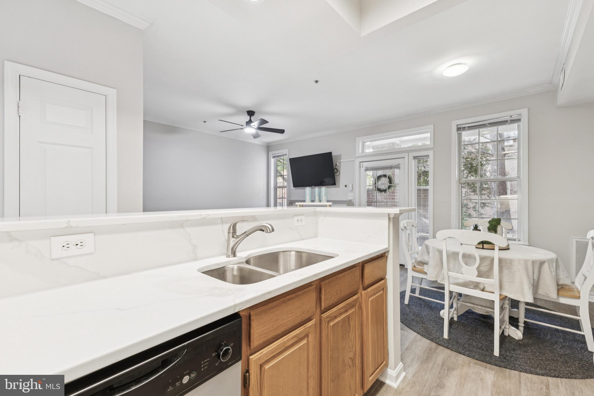 1361 Garden Wall Circle, Unit 701 Reston, VA 20194 - Photo 9 of 15 a kitchen with a sink cabinets and window