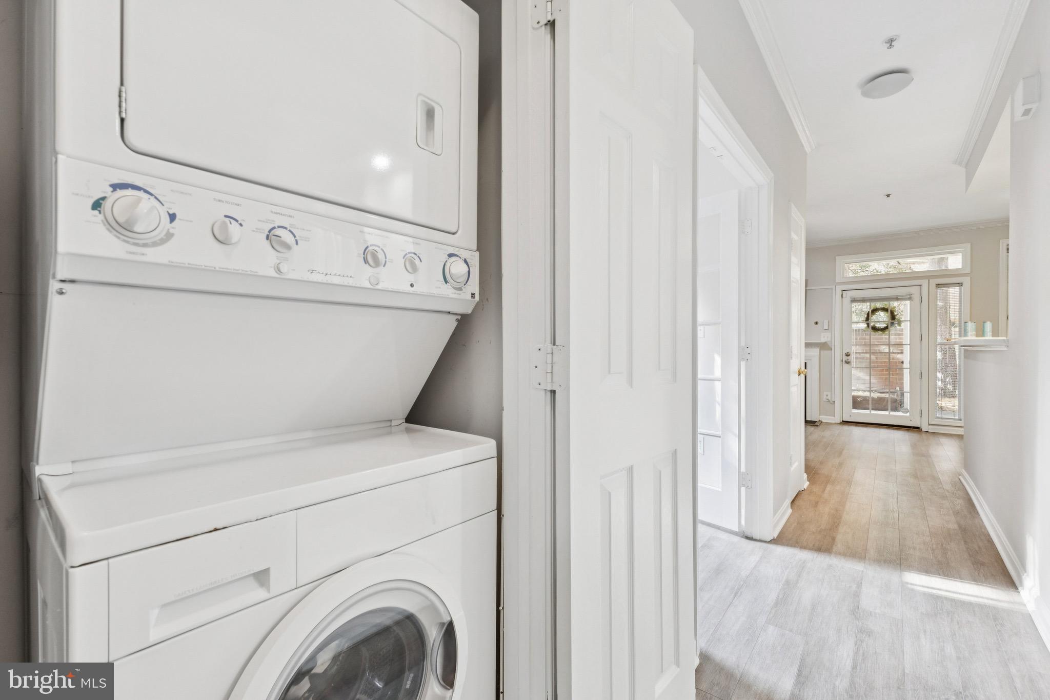 1361 Garden Wall Circle, Unit 701 Reston, VA 20194 - Photo 10 of 15 a view of a hallway with washer and dryer