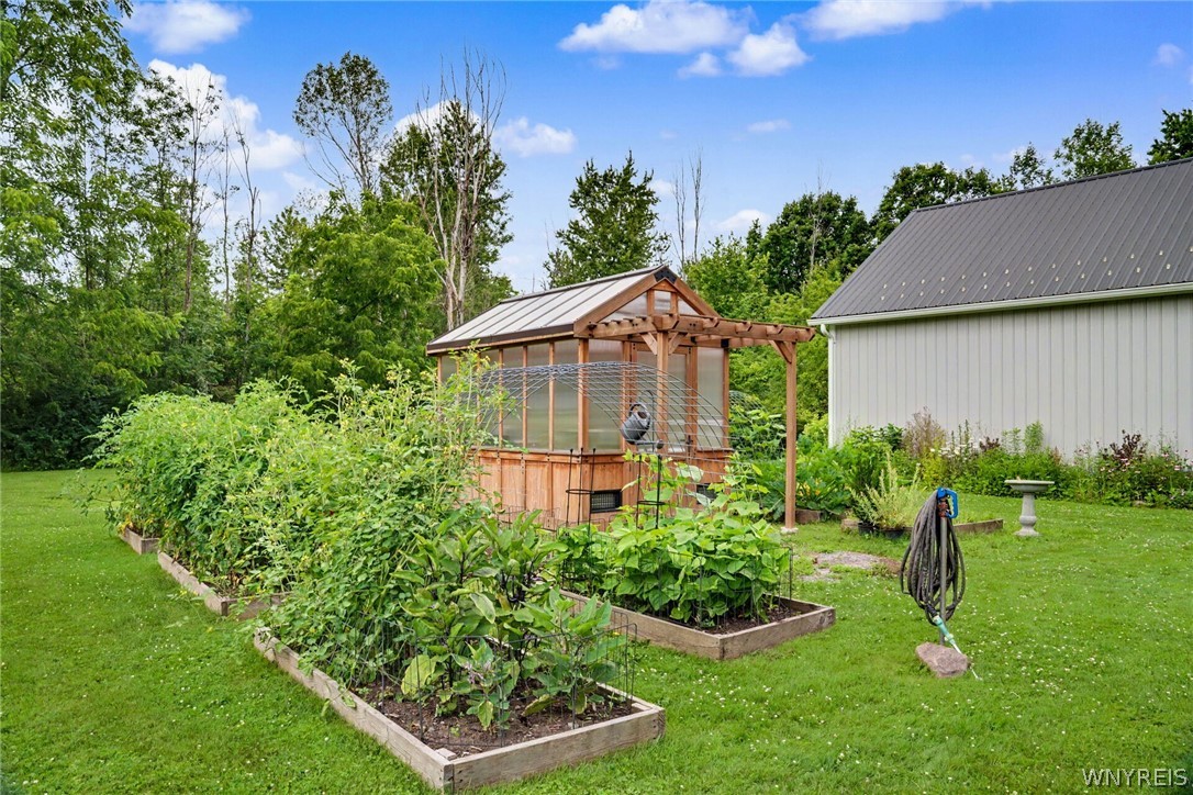 6600 Dye Road Newstead, NY 14001 - Photo 8 of 50 Side front angle of garden w/ well water access for watering