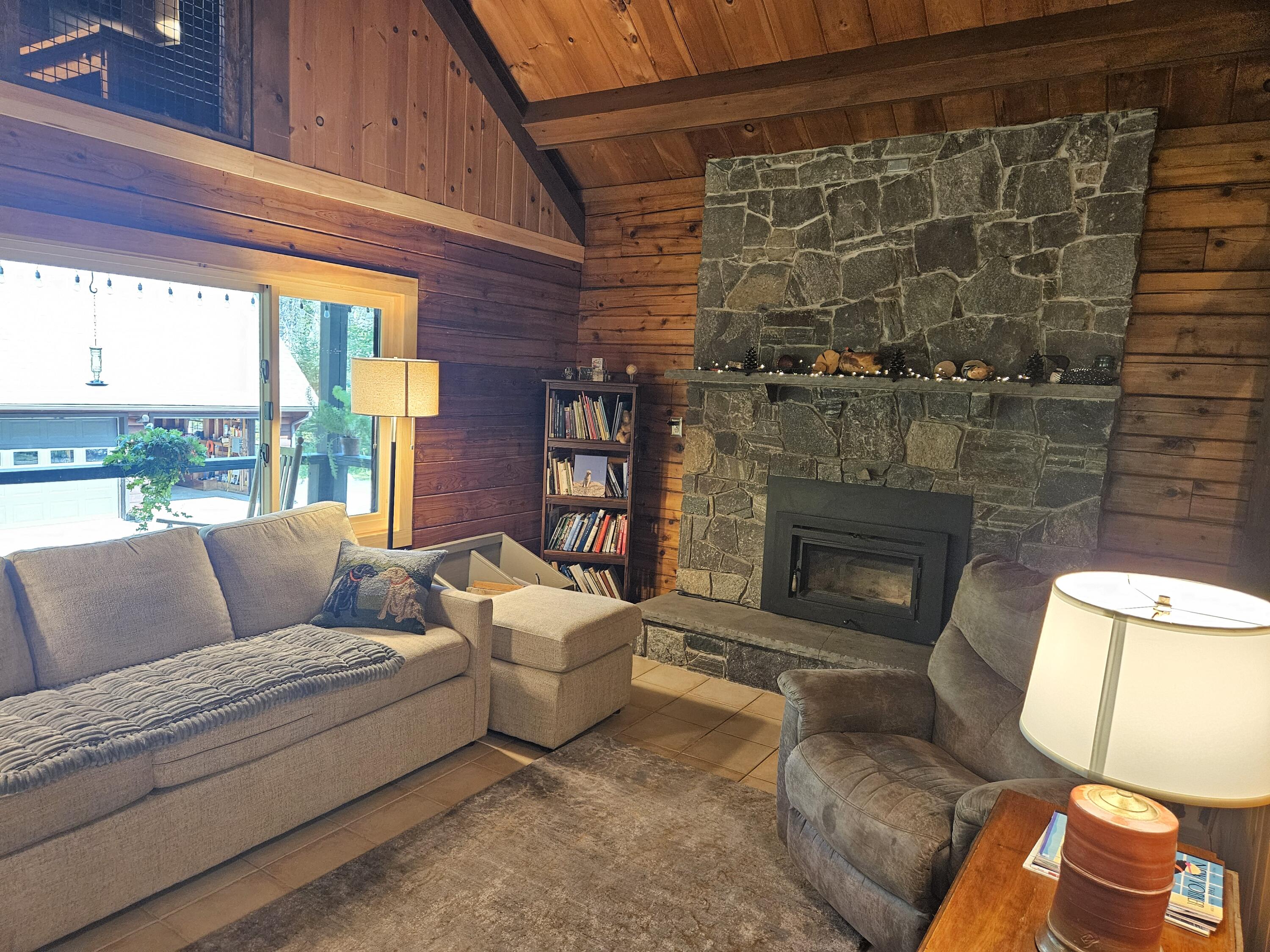 901 Mann Hill Road Holden, ME 04429 - Photo 9 of 54 7. Woodstove for Warmth and Comfort