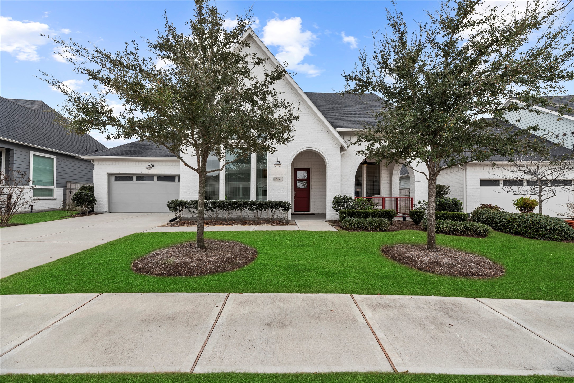 5535 Water Terrace Lane Fulshear, TX 77441 - Photo 1 of 43 a front view of a house with a garden