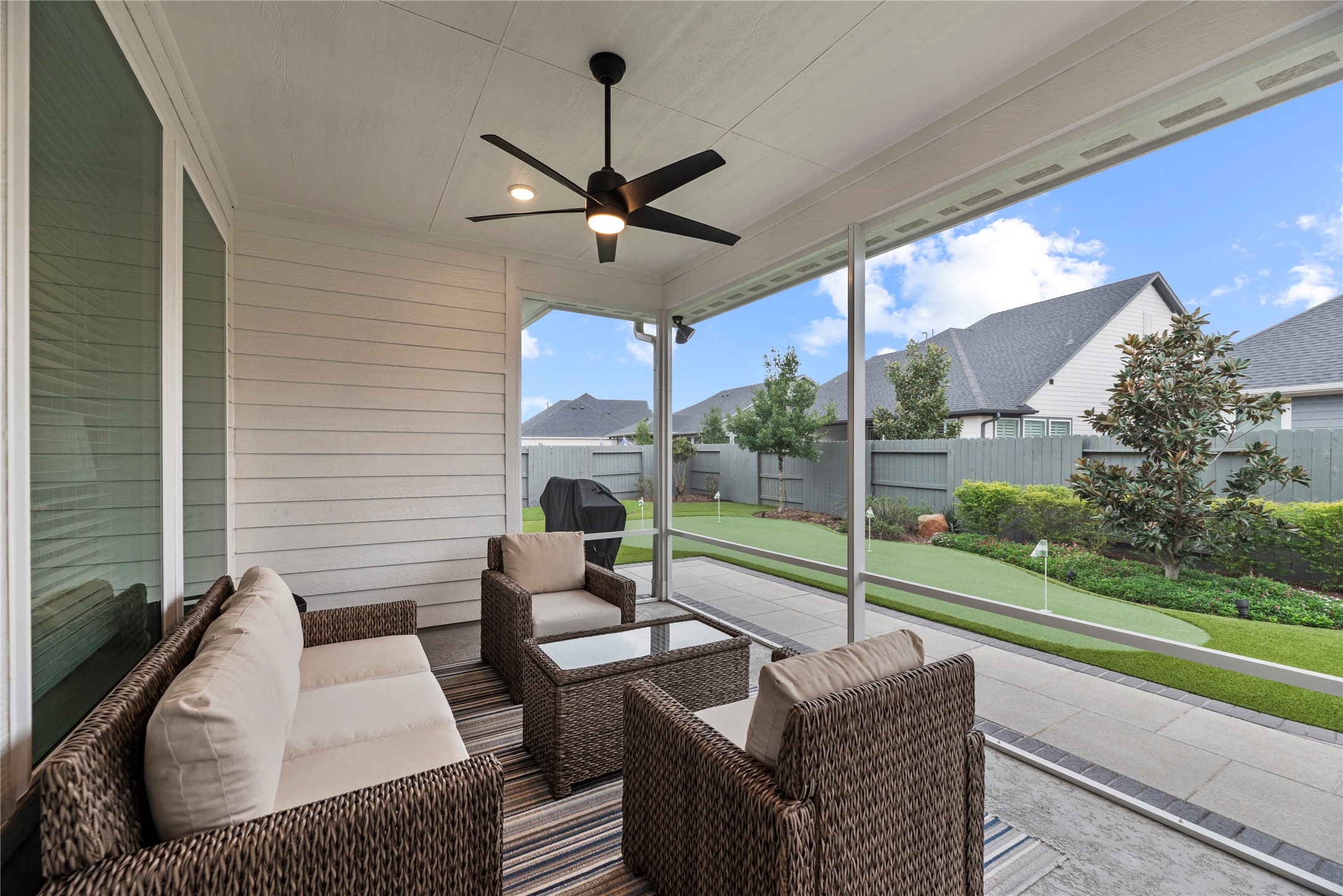 5535 Water Terrace Lane Fulshear, TX 77441 - Photo 15 of 43 a view of a patio with couches chairs and a yard