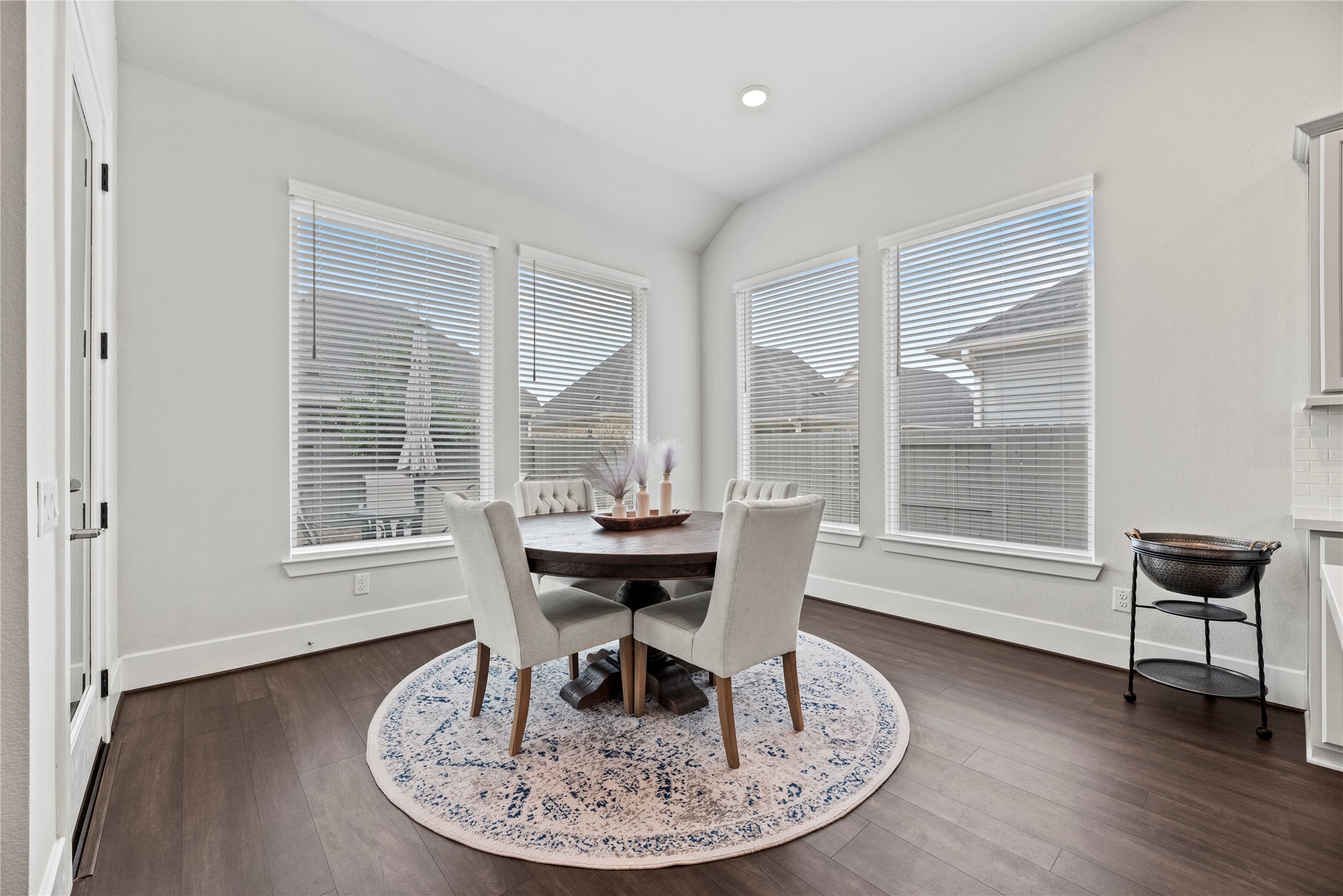 5535 Water Terrace Lane Fulshear, TX 77441 - Photo 16 of 43 a dining room with furniture window and wooden floor