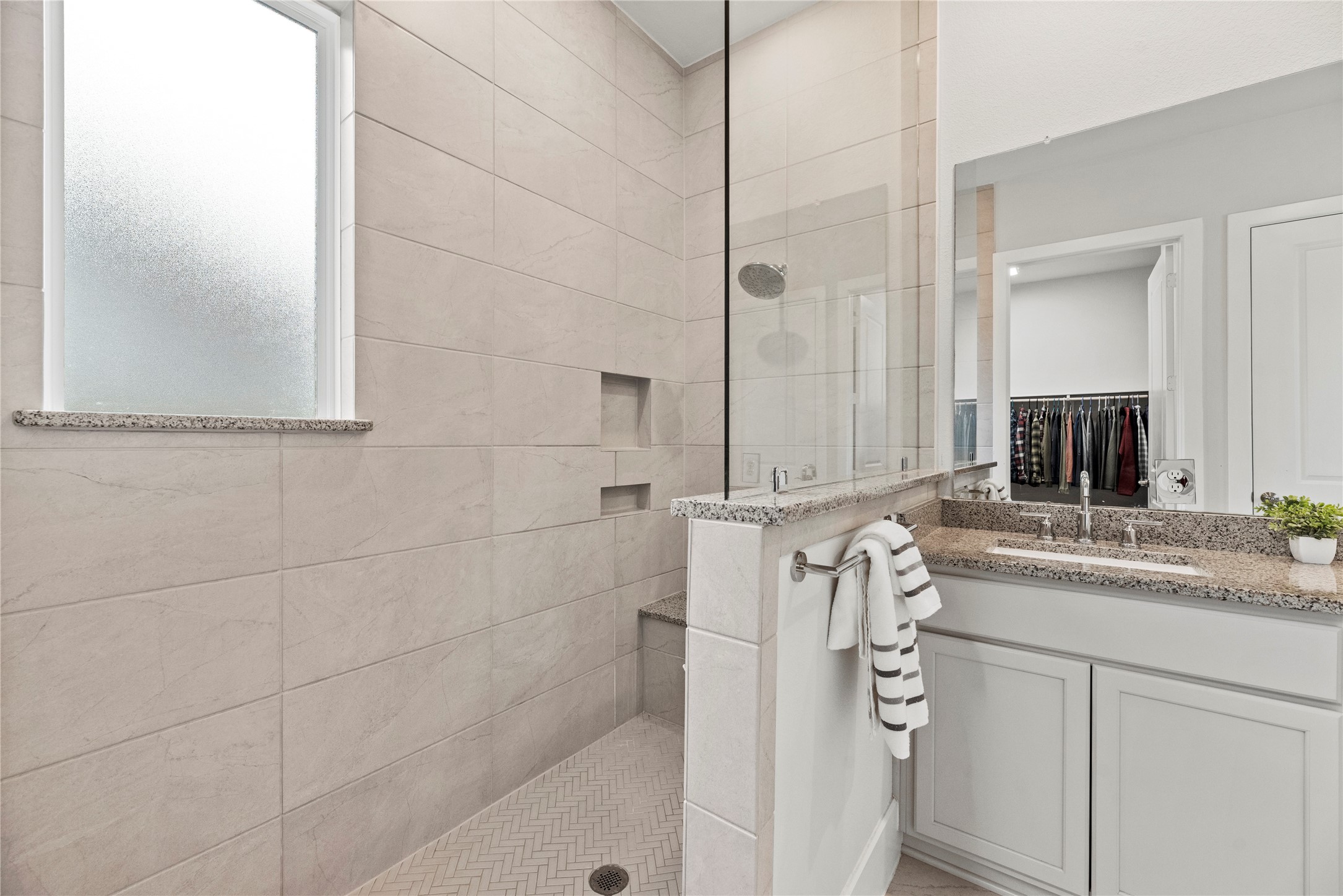 5535 Water Terrace Lane Fulshear, TX 77441 - Photo 25 of 43 a bathroom with a double vanity sink a mirror and shower