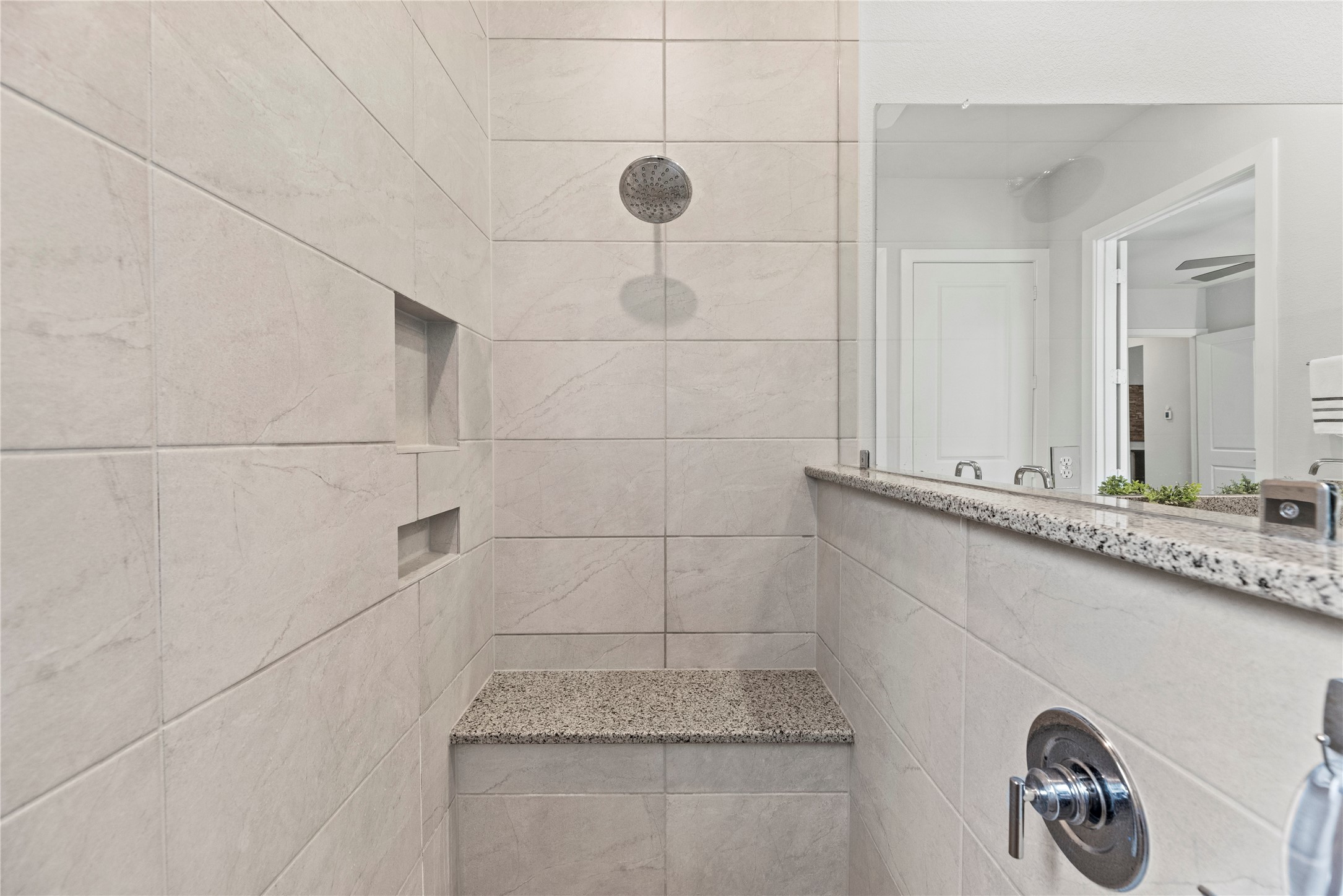 5535 Water Terrace Lane Fulshear, TX 77441 - Photo 26 of 43 a bathroom with a granite countertop sink a mirror and shower