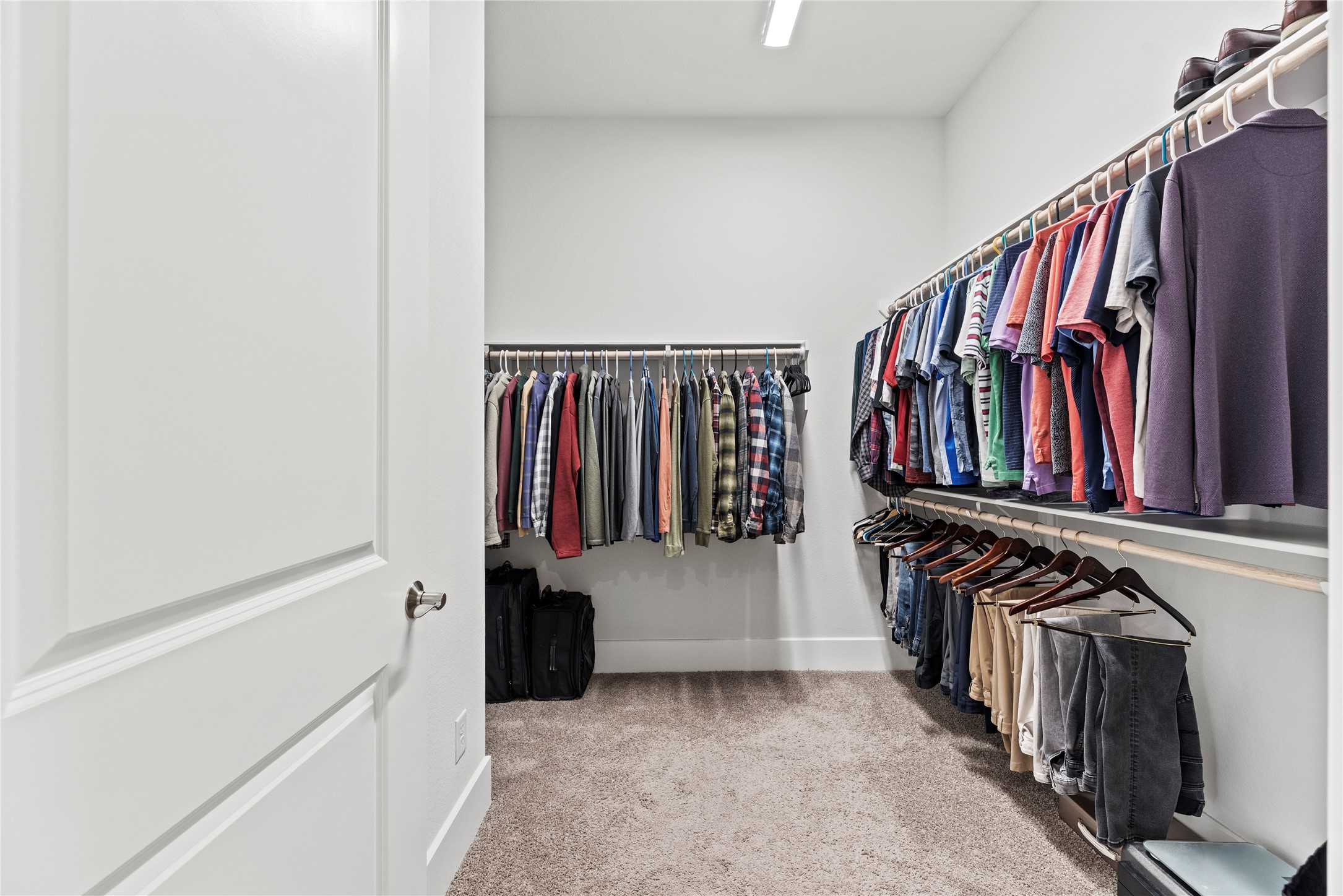 5535 Water Terrace Lane Fulshear, TX 77441 - Photo 27 of 43 a view of walk in closet with clothes and shoes