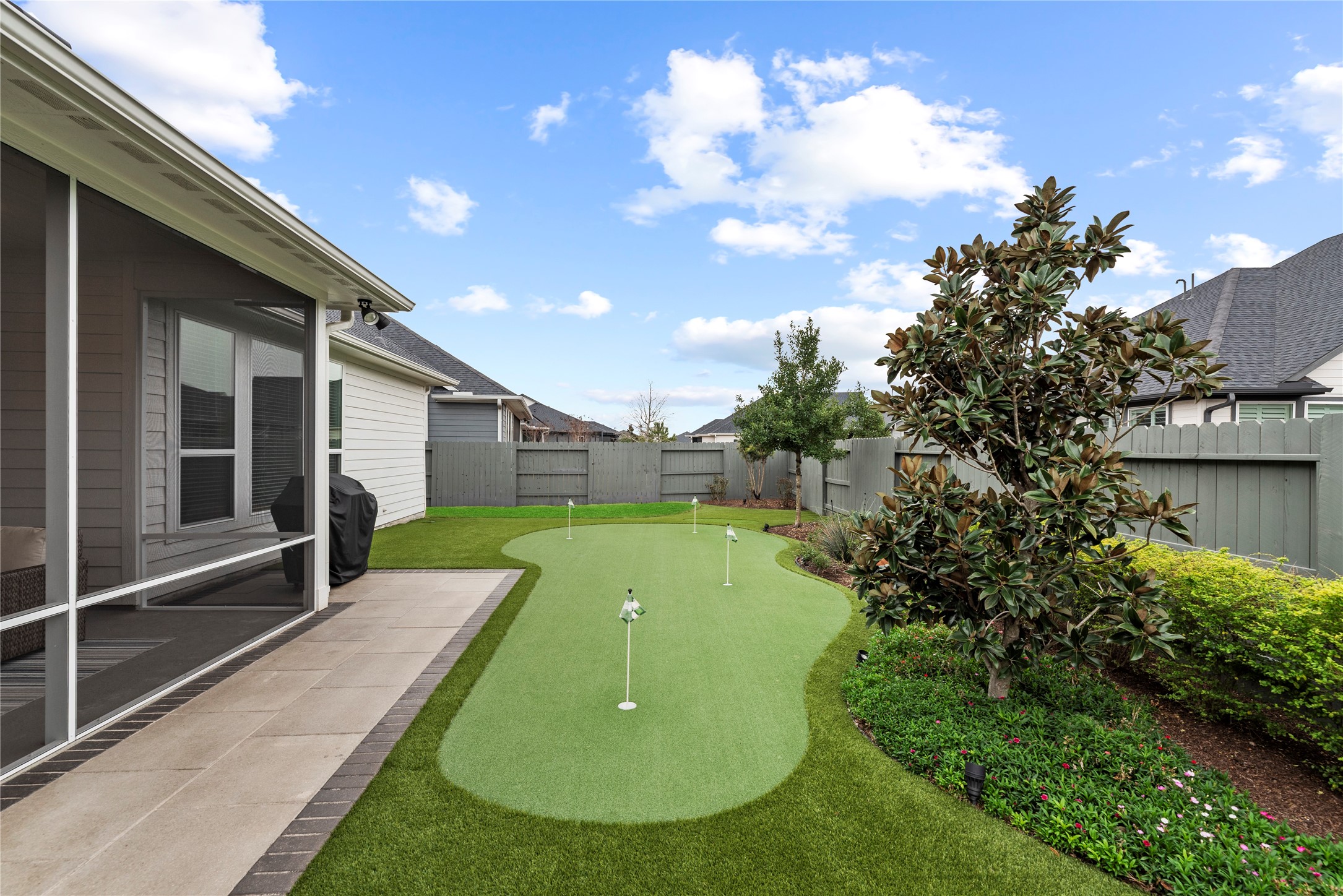 5535 Water Terrace Lane Fulshear, TX 77441 - Photo 31 of 43 a view of a backyard with trampoline