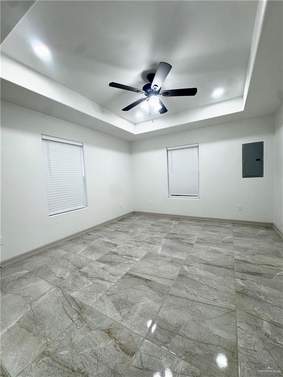 401 Stuart Court Alamo, TX 78516 - Photo 5 of 11 en empty room with ceiling fan and window