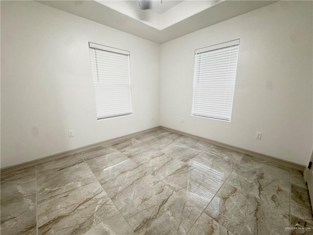 401 Stuart Court Alamo, TX 78516 - Photo 7 of 11 an empty room with a window