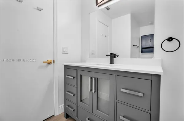 a bathroom with a sink and a mirror