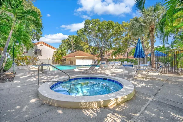 a view of a swimming pool with a patio