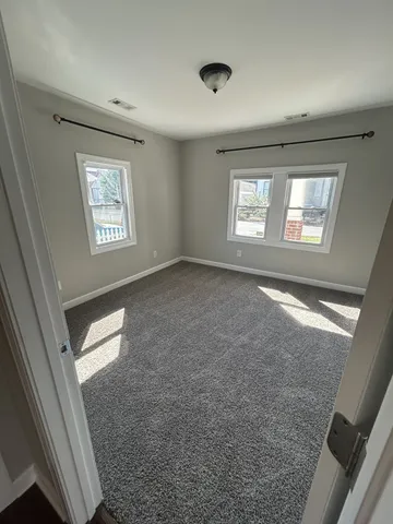 a view of an empty room and window