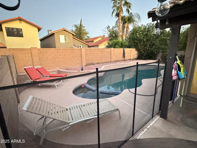a balcony with table and chairs