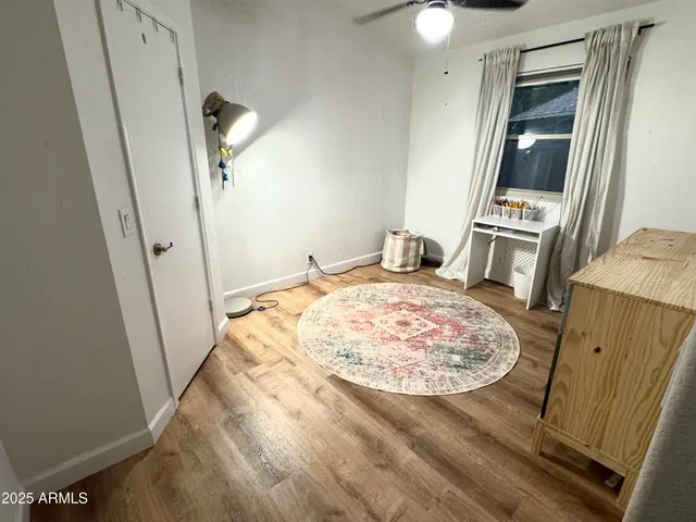 a view of a kitchen from a hallway