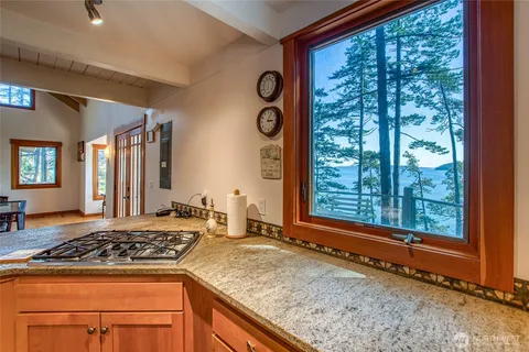 a kitchen with stainless steel appliances granite countertop a stove and a sink