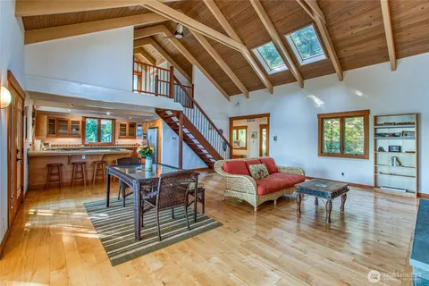 a kitchen with stainless steel appliances granite countertop a sink and a stove