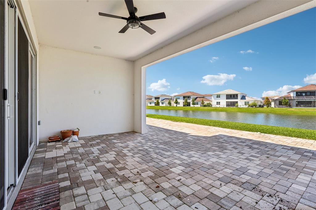 8743 Sanders Tree Loop Wesley Chapel, FL 33545 - Photo 34 of 41 a view of a house with a lake view