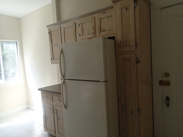 139 Winter Street, Unit 1 Framingham, MA 01702 - Photo 3 of 11 a white refrigerator freezer and a dishwasher in a kitchen