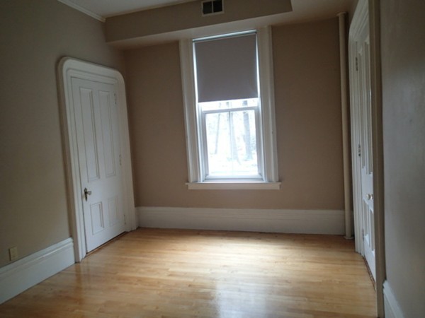 139 Winter Street, Unit 1 Framingham, MA 01702 - Photo 7 of 11 an empty room with windows