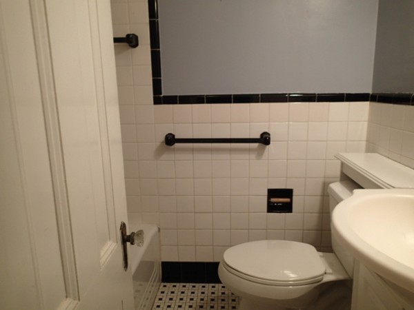 139 Winter Street, Unit 1 Framingham, MA 01702 - Photo 9 of 11 a bathroom with a toilet and a shower
