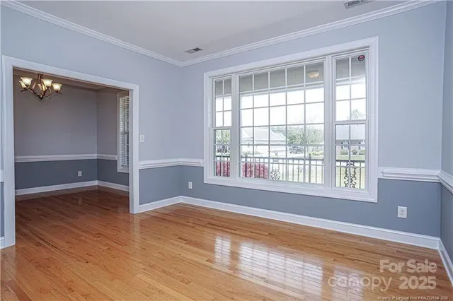 a kitchen with granite countertop a stove cabinets and microwave