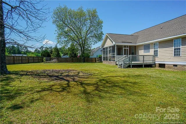 a view of a house with a big yard
