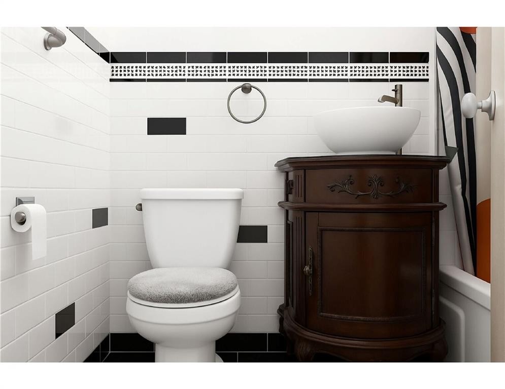 41 Jane Street, Unit 5B Manhattan, NY 10014 - Photo 7 of 8 a bathroom with a toilet and a shower