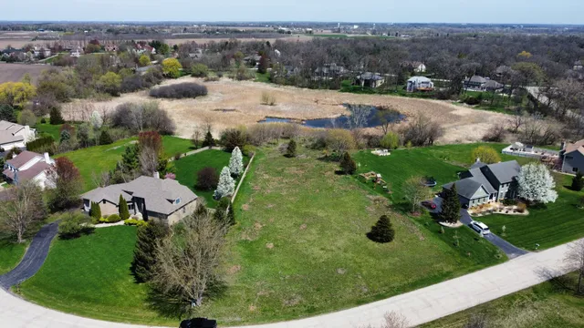 an aerial view of a golf course with parking space