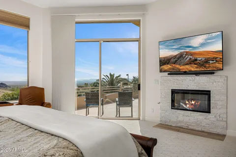 a spacious bathroom with a granite countertop tub and a large window