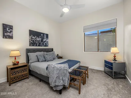 a bathroom with a granite countertop sink a mirror and a shower curtain