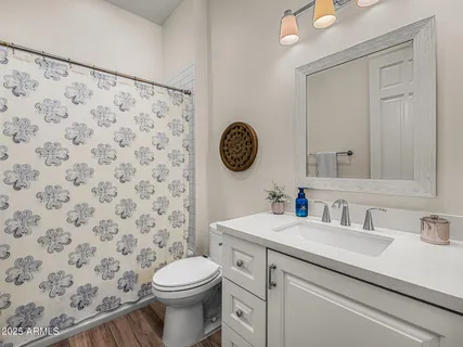 a view of a yard with mountain and wooden fence