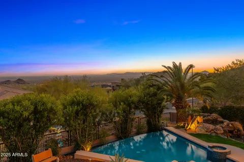 a view of swimming pool with sitting area