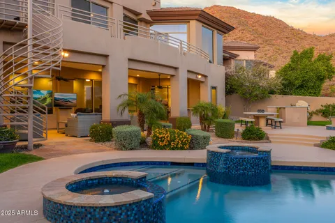 a view of swimming pool with a yard and sitting area