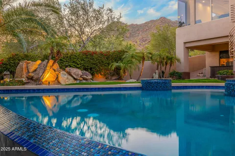 a view of a pool with a yard