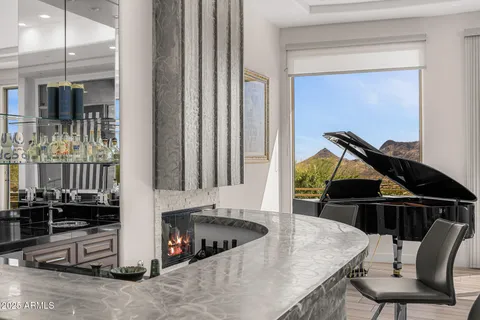a kitchen with a table chairs and a wooden floor