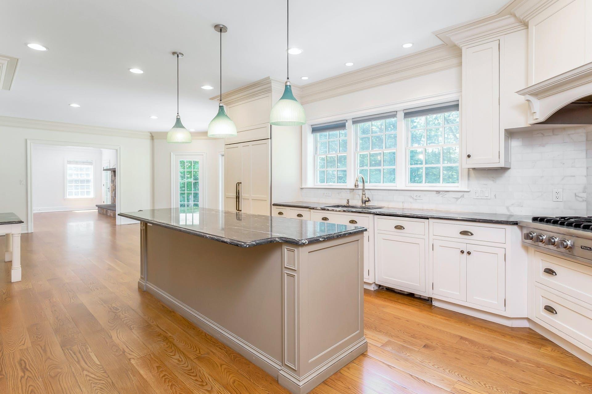 274 Mariomi Road New Canaan, CT 06840 - Photo 15 of 56 a kitchen with stainless steel appliances granite countertop a sink a stove and a wooden floors