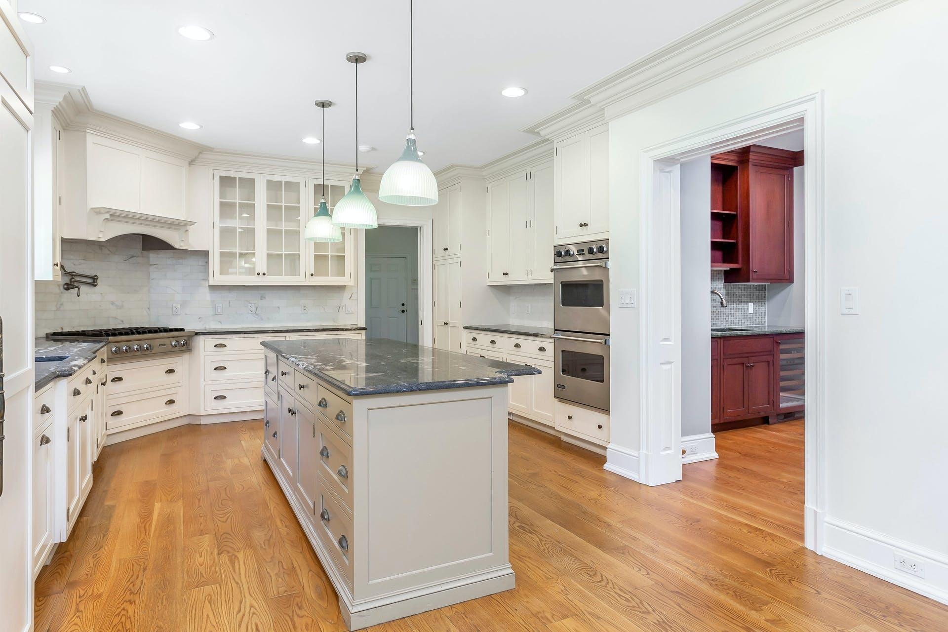 274 Mariomi Road New Canaan, CT 06840 - Photo 17 of 56 a kitchen with stainless steel appliances granite countertop a refrigerator a stove and a wooden floors