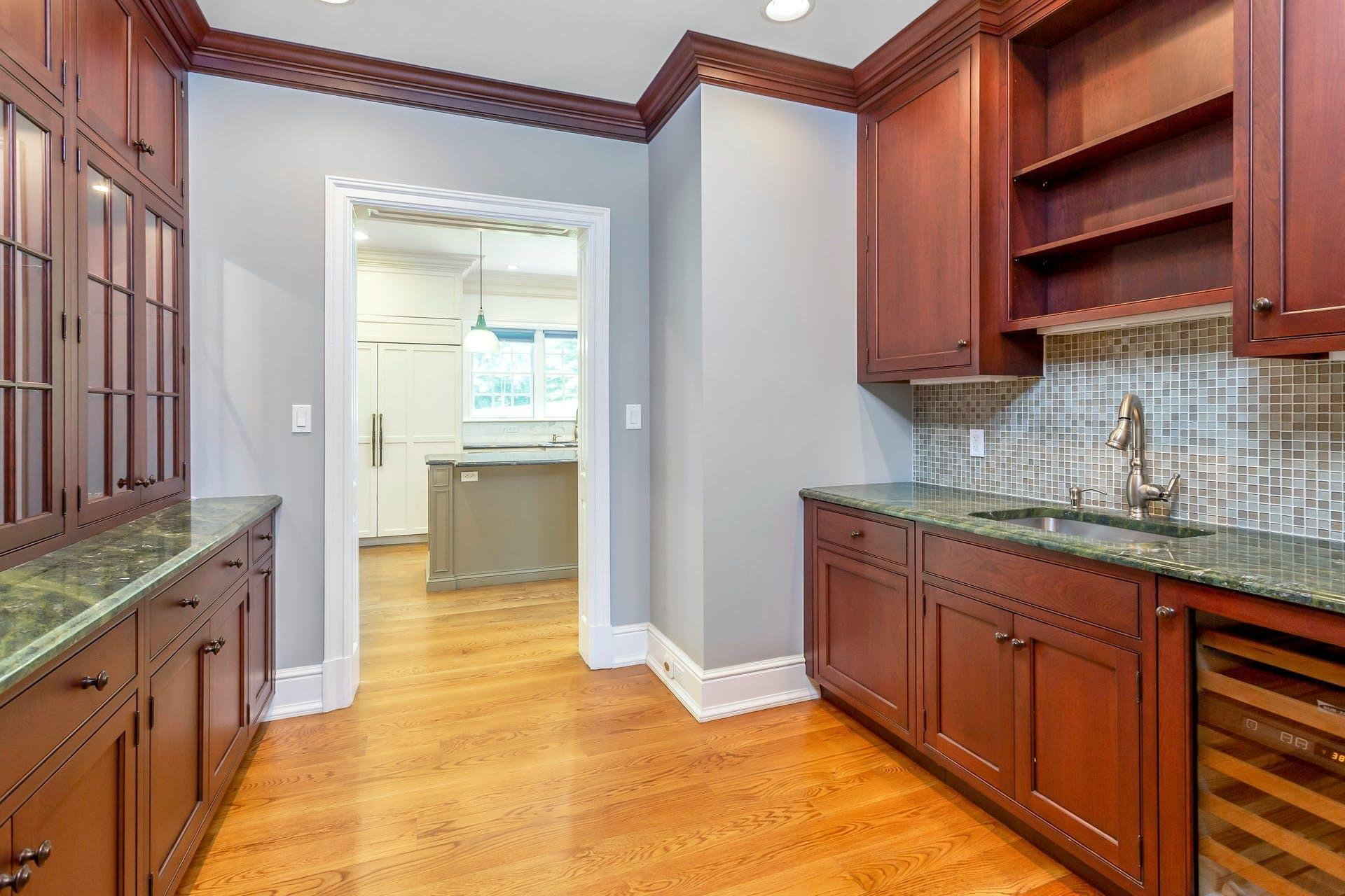 274 Mariomi Road New Canaan, CT 06840 - Photo 18 of 56 a kitchen with granite countertop a sink and cabinets