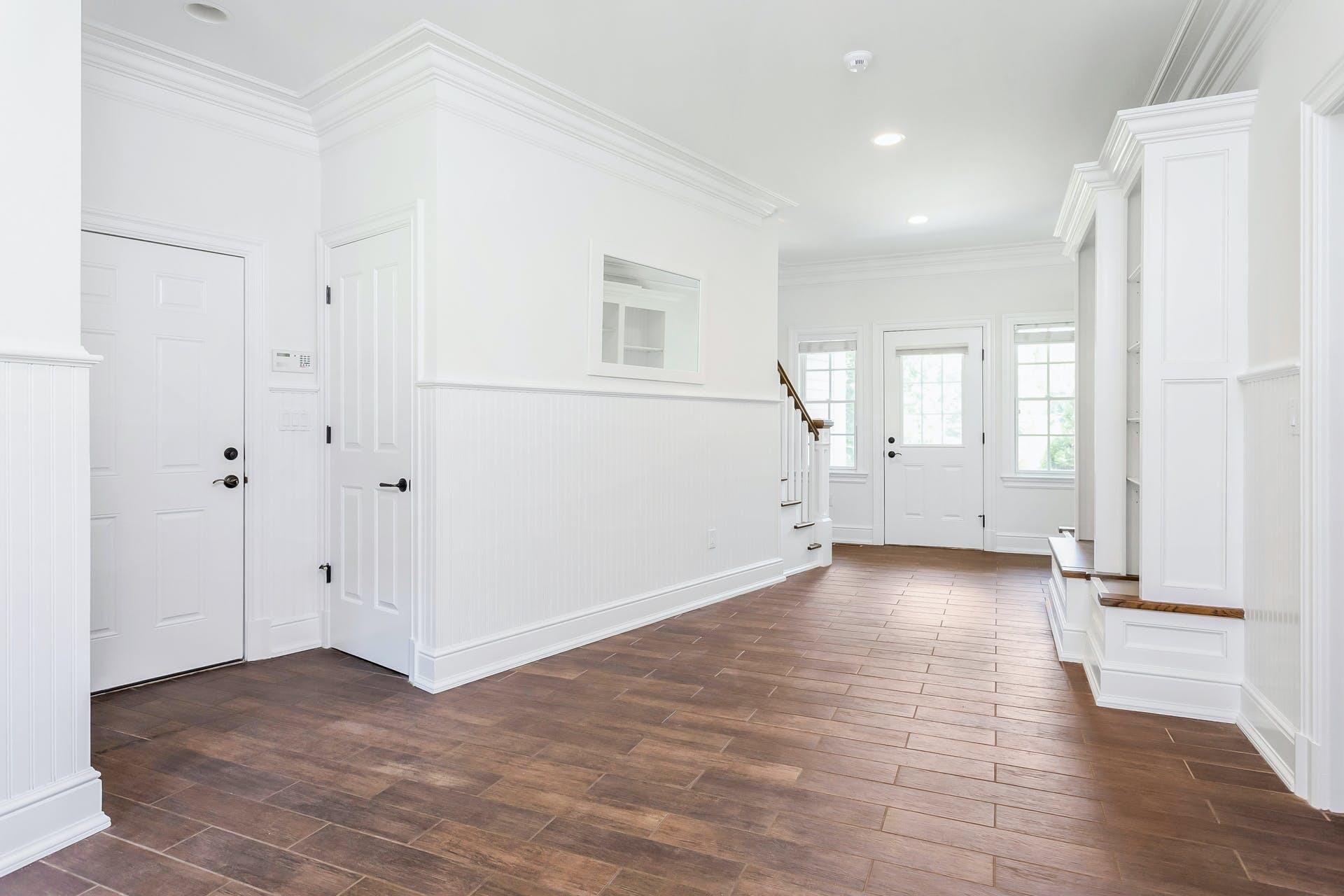 274 Mariomi Road New Canaan, CT 06840 - Photo 23 of 56 an empty room with wooden floor and white walls