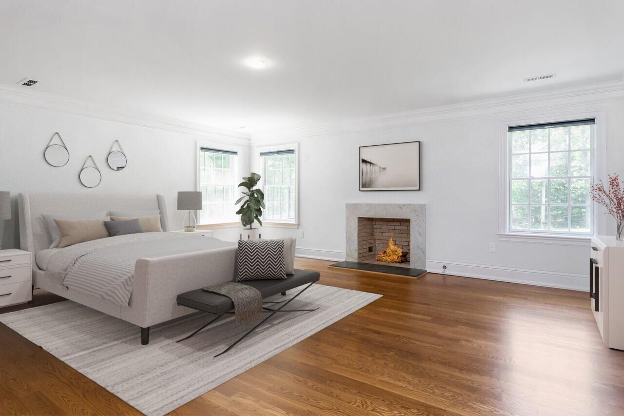 274 Mariomi Road New Canaan, CT 06840 - Photo 25 of 56 a room with a bed and a fireplace